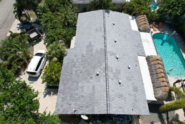 Rooftop Tech crew working on a residential roof in Miami